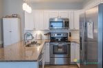 Stainless steel appliances complete the remodeled kitchen.